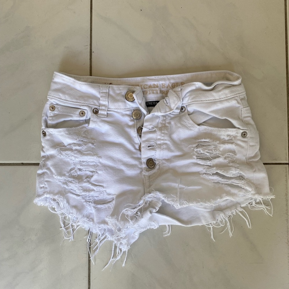 White ripped jean shorts